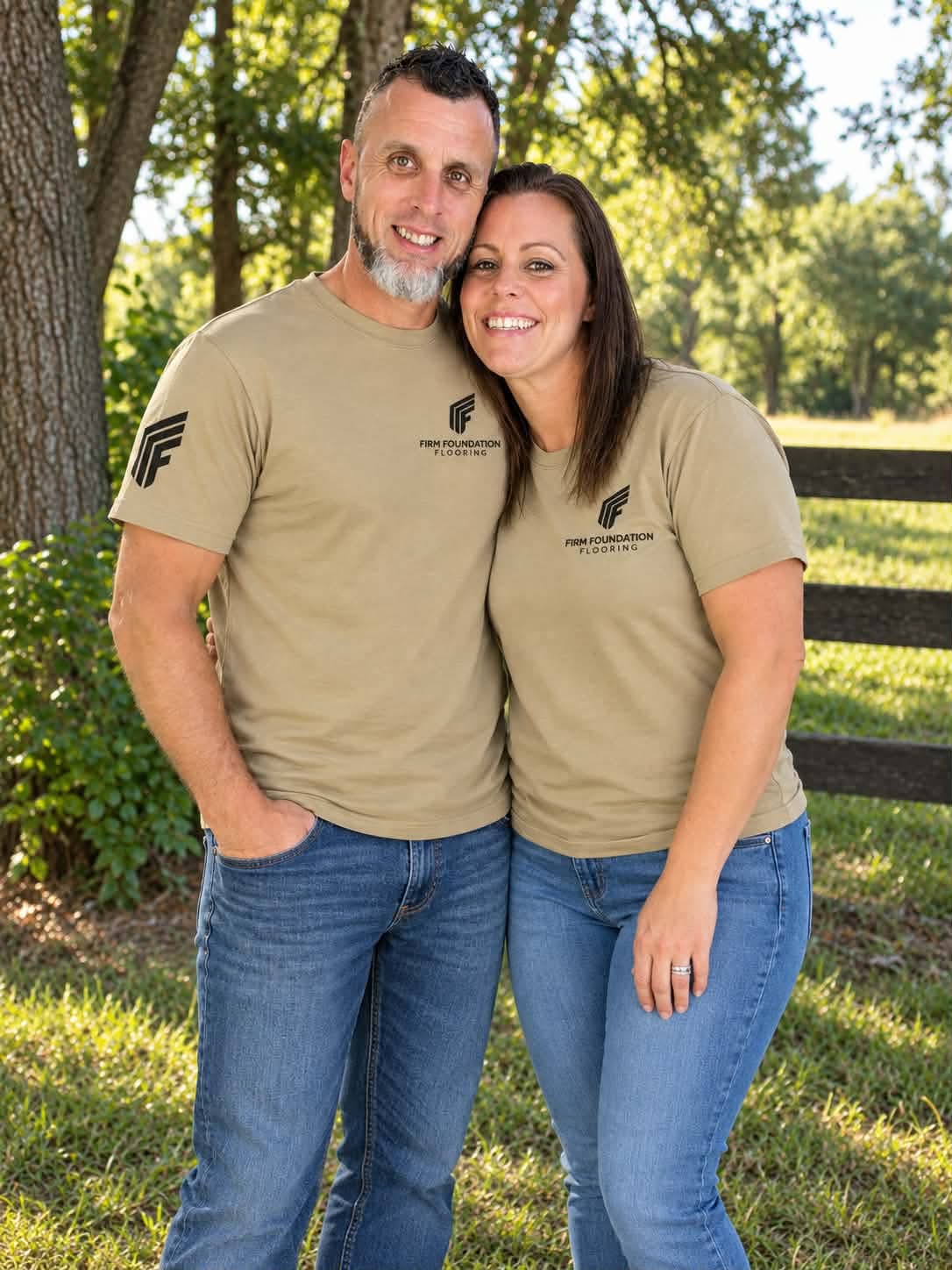 Mike and Carmen, owners of Firm Foundation Flooring, wearing Firm Foundation Flooring shirts
