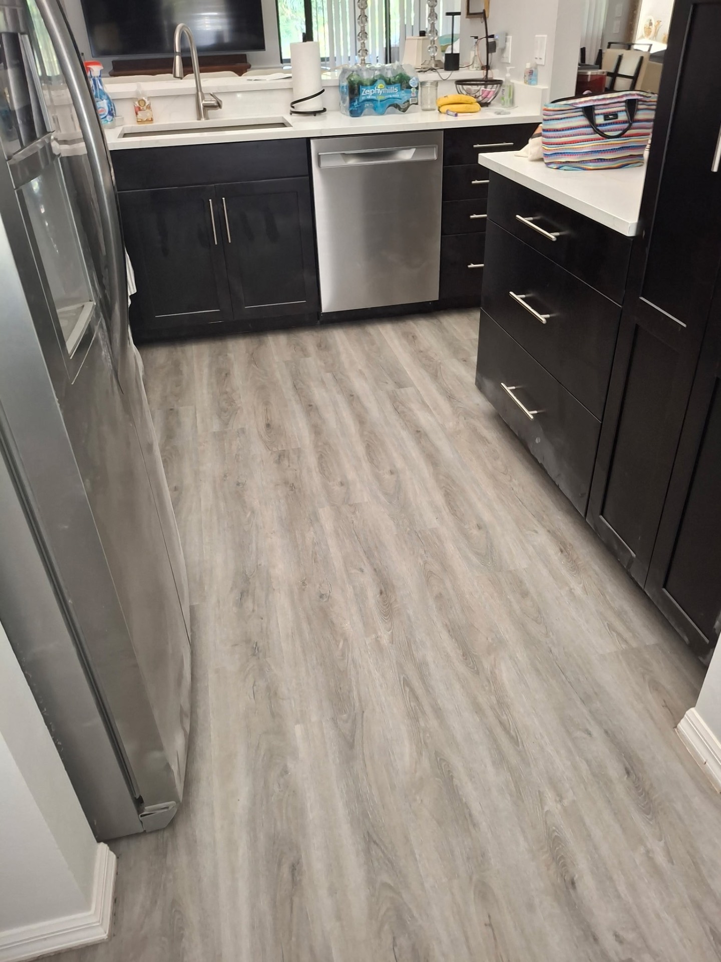 Finished plank flooring in a kitchen